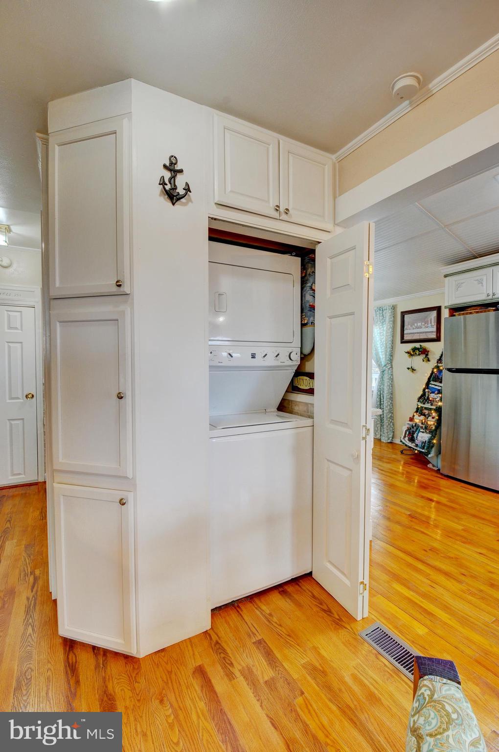 384 Perry Road Winchester, VA 22602 - Photo 19 of 61 a view of a livingroom with wooden floor and a ceiling fan