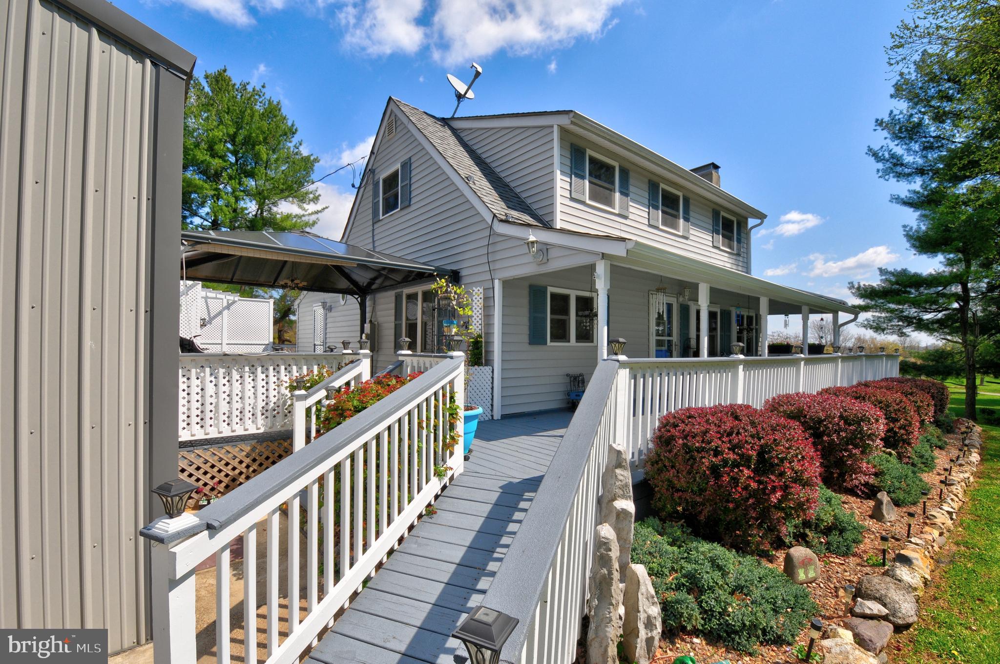 384 Perry Road Winchester, VA 22602 - Photo 3 of 61 a front view of a house with balcony and trees