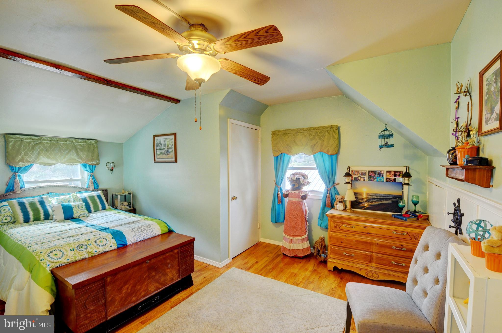 384 Perry Road Winchester, VA 22602 - Photo 25 of 61 a bedroom with a bed and wooden floor