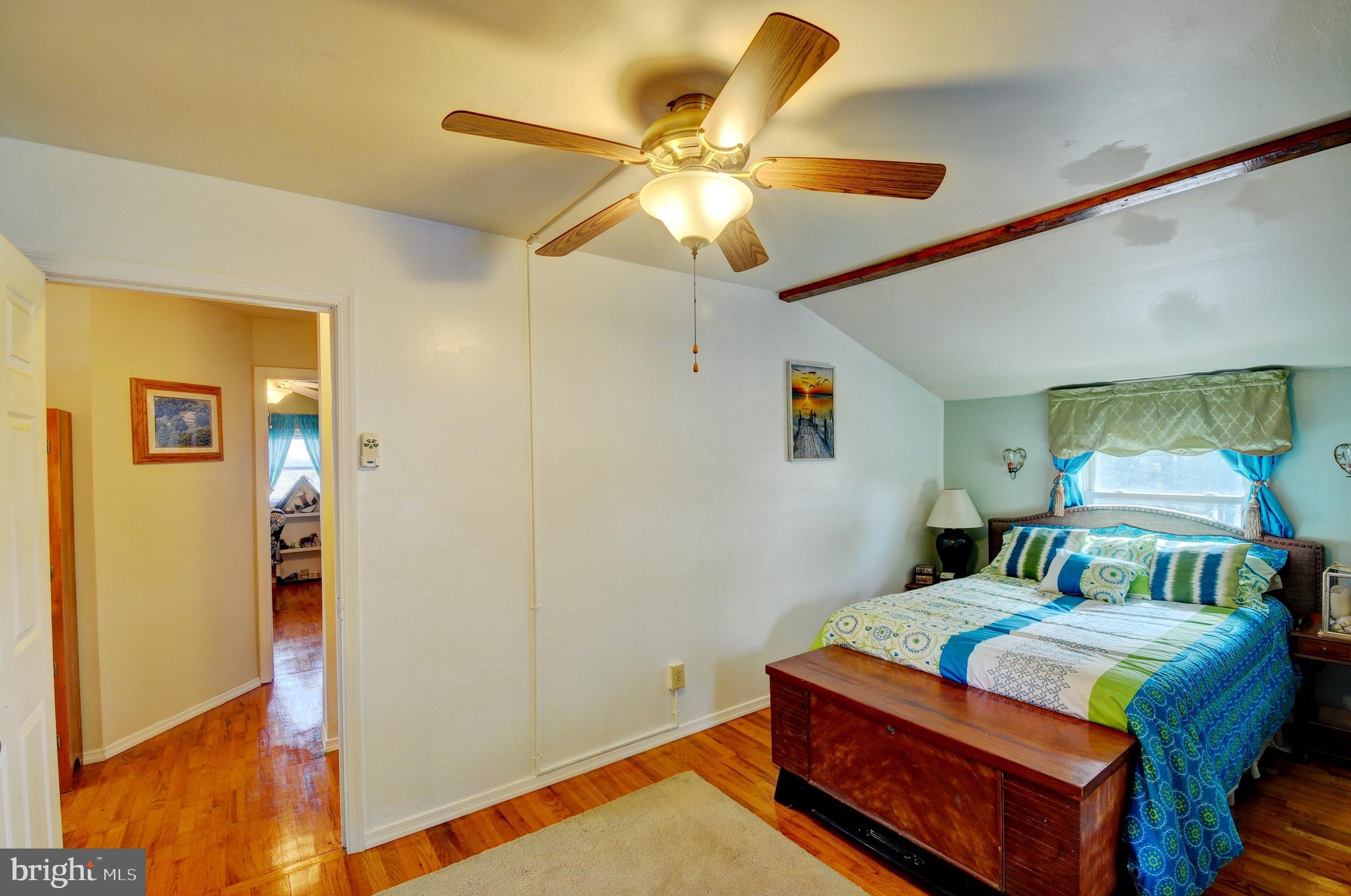 384 Perry Road Winchester, VA 22602 - Photo 26 of 61 a bedroom with a bed and wooden floor