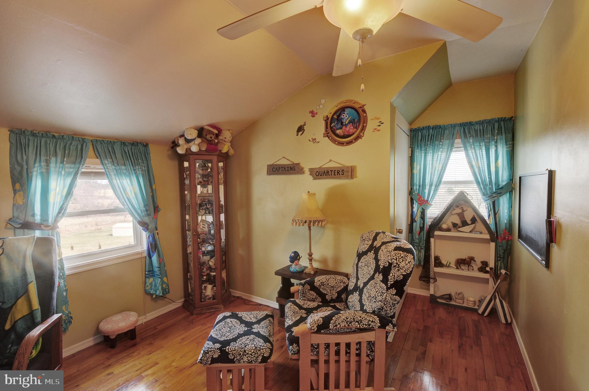 384 Perry Road Winchester, VA 22602 - Photo 30 of 61 a living room with furniture and a large window