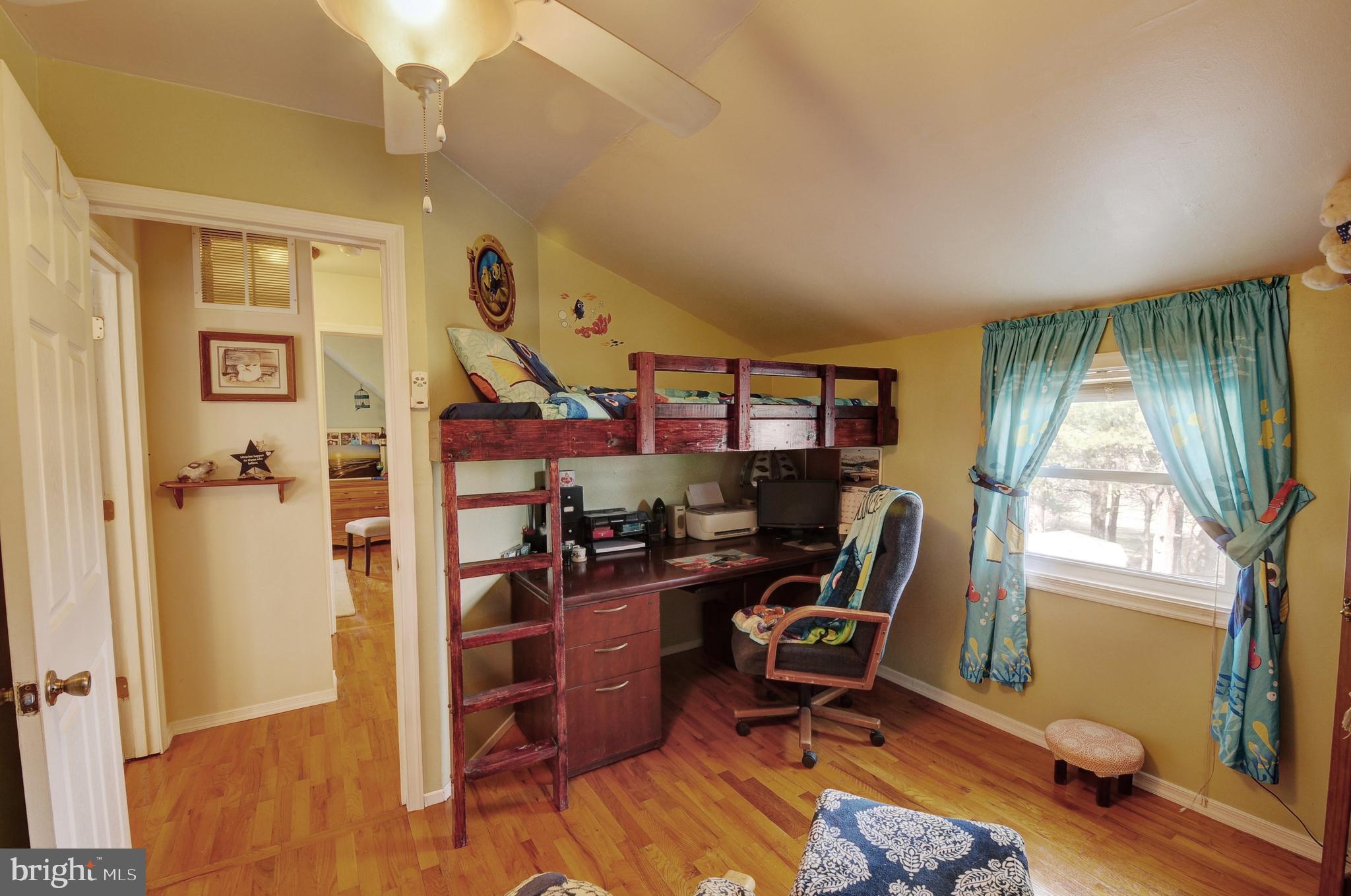 384 Perry Road Winchester, VA 22602 - Photo 31 of 61 a view of a workspace with furniture and a window