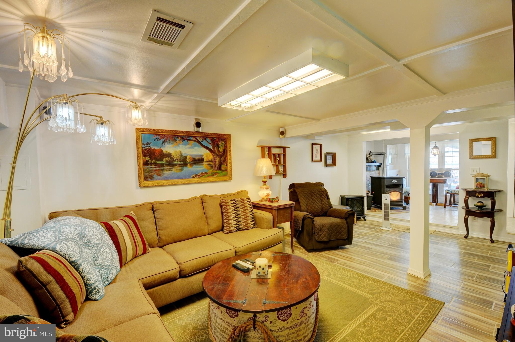 384 Perry Road Winchester, VA 22602 - Photo 32 of 61 a living room with furniture and wooden floor