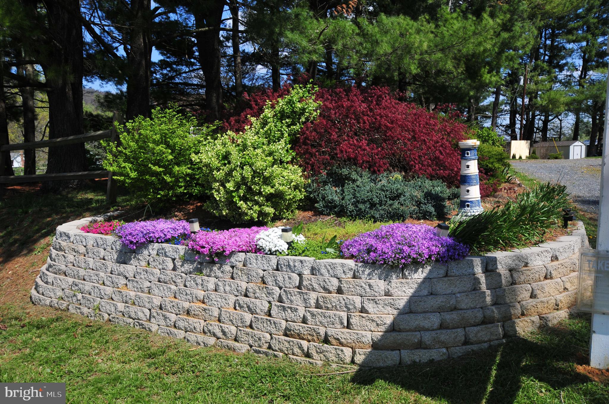 384 Perry Road Winchester, VA 22602 - Photo 56 of 61 a view of a yard with flower plants