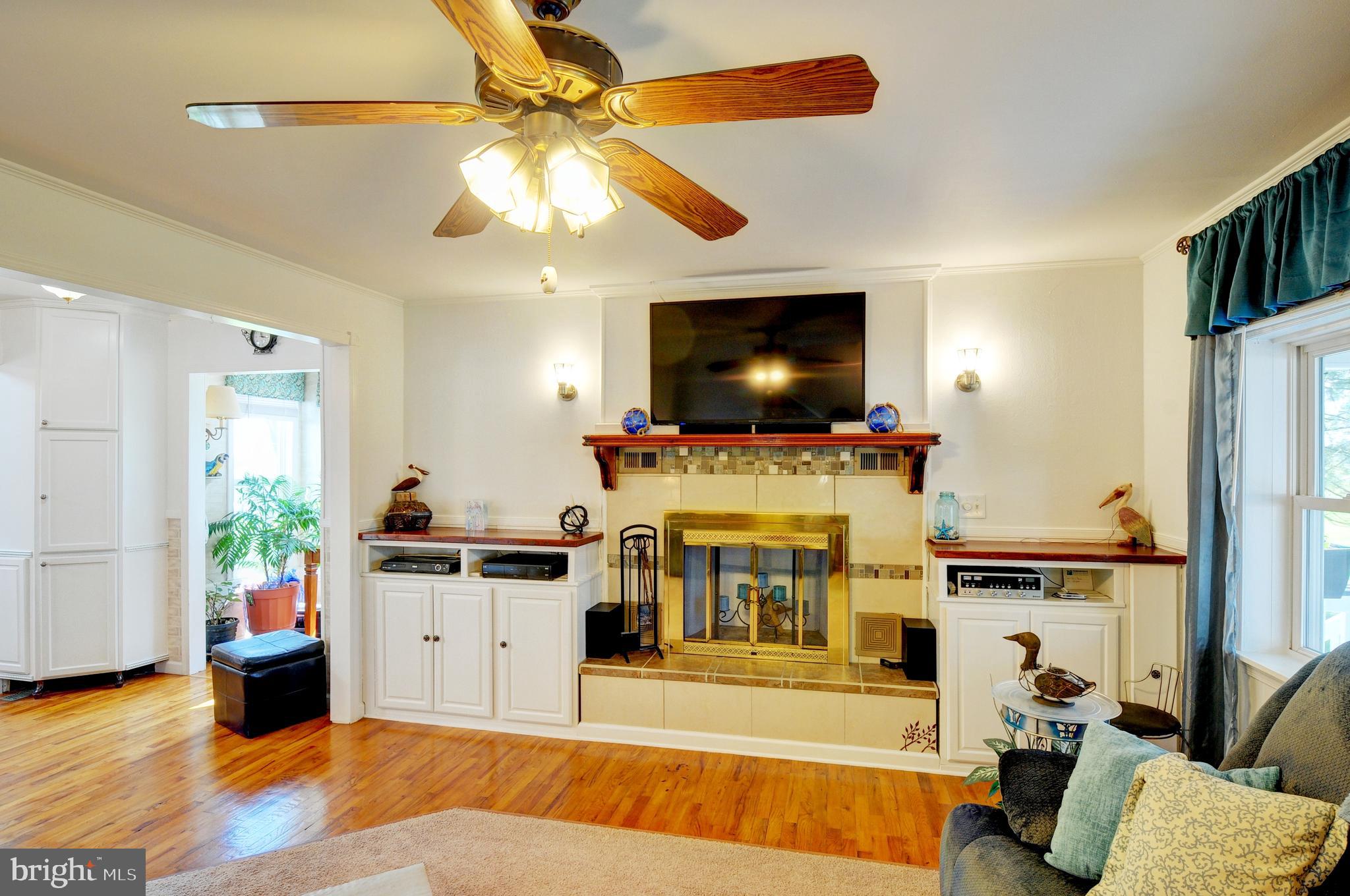 384 Perry Road Winchester, VA 22602 - Photo 7 of 61 a living room with furniture and a flat screen tv