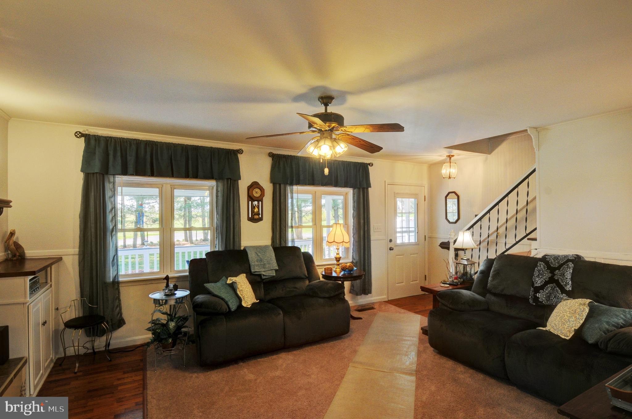 384 Perry Road Winchester, VA 22602 - Photo 9 of 61 a living room with furniture and a large window
