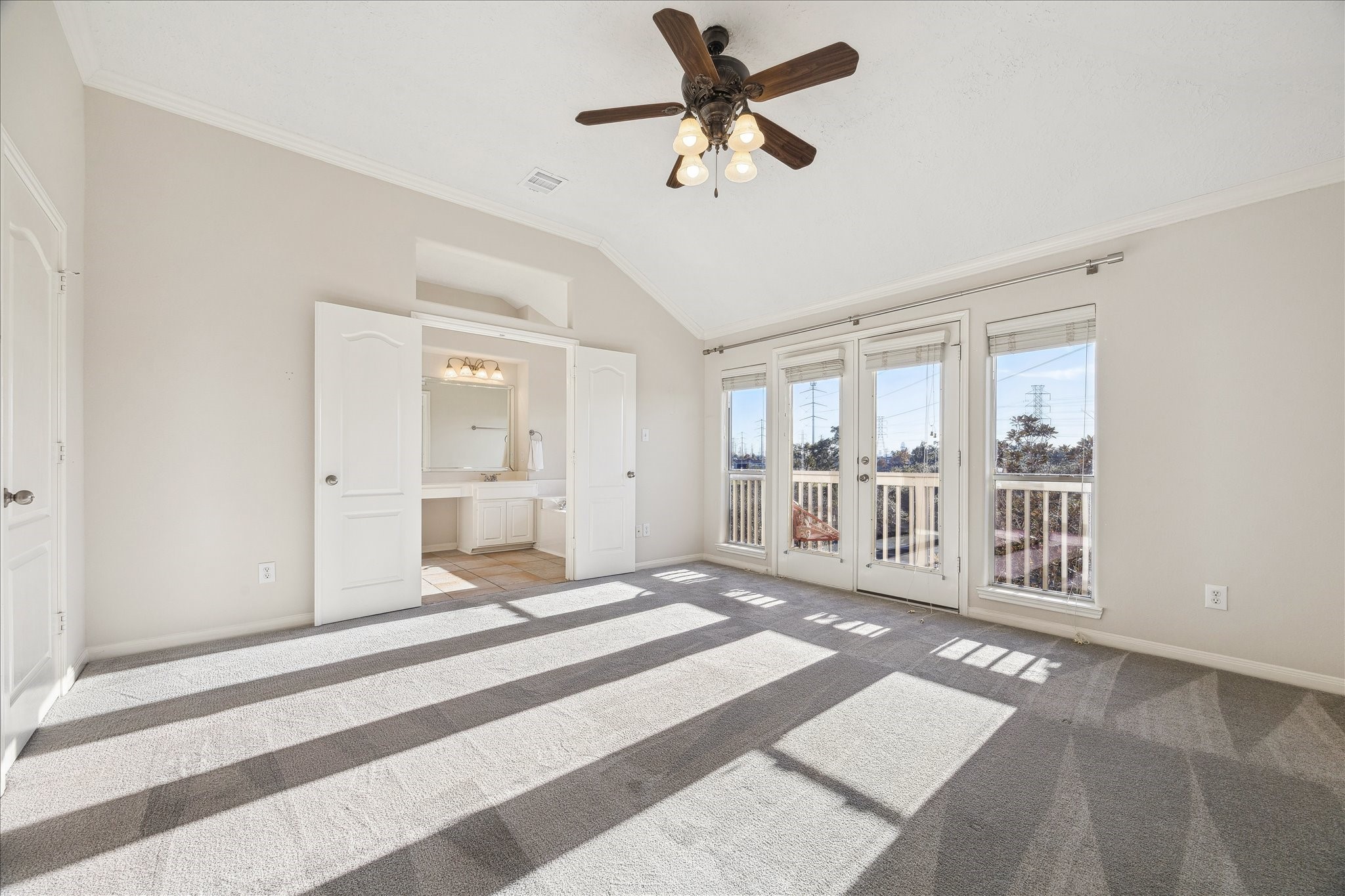 1839 Stacy Crest Houston, TX 77008 - Photo 17 of 39 a bedroom with a large bed and a chandelier fan