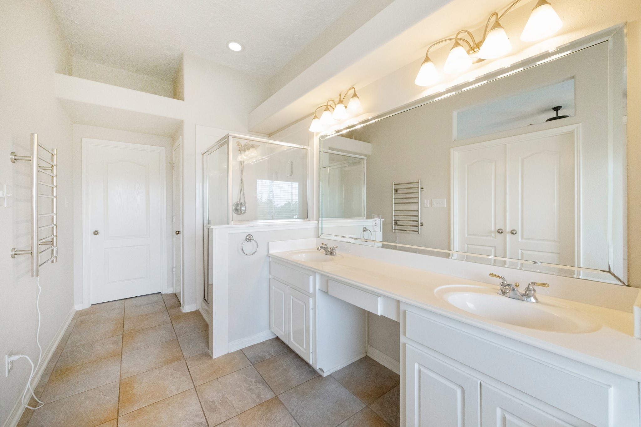 1839 Stacy Crest Houston, TX 77008 - Photo 19 of 39 a bathroom with a sink double vanity and a mirror