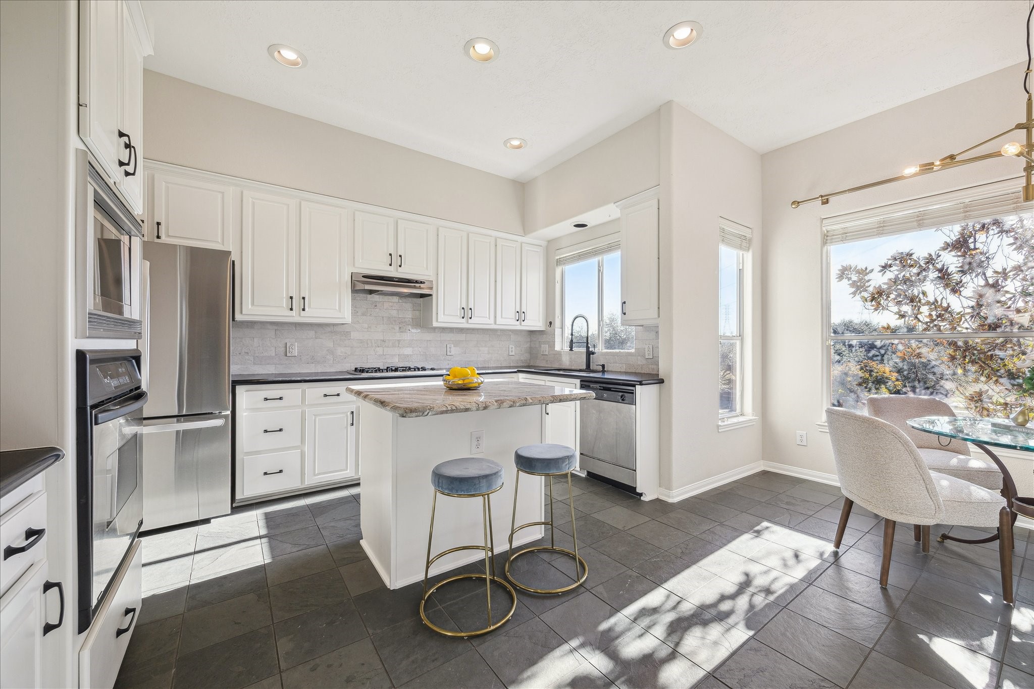 1839 Stacy Crest Houston, TX 77008 - Photo 2 of 39 a kitchen with white cabinets and appliances