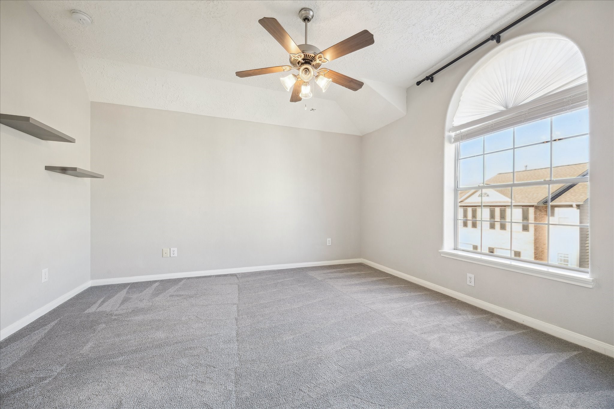 1839 Stacy Crest Houston, TX 77008 - Photo 24 of 39 an empty room with windows and ceiling fan
