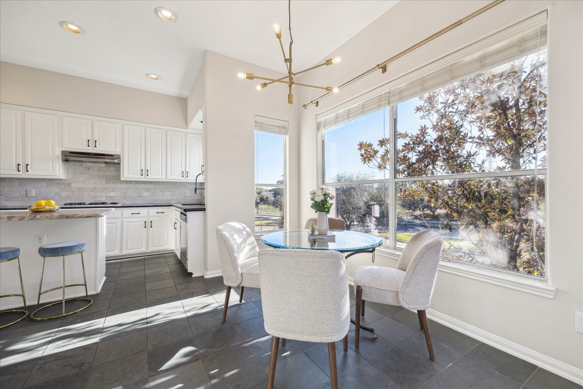 1839 Stacy Crest Houston, TX 77008 - Photo 3 of 39 a dining room with wooden floor and large window