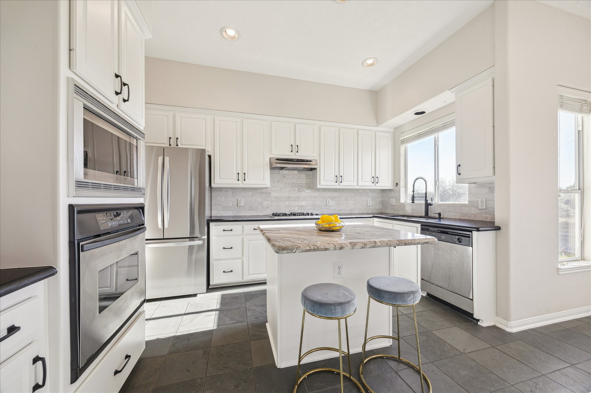 1839 Stacy Crest Houston, TX 77008 - Photo 6 of 39 a kitchen with stainless steel appliances a stove refrigerator sink and cabinets