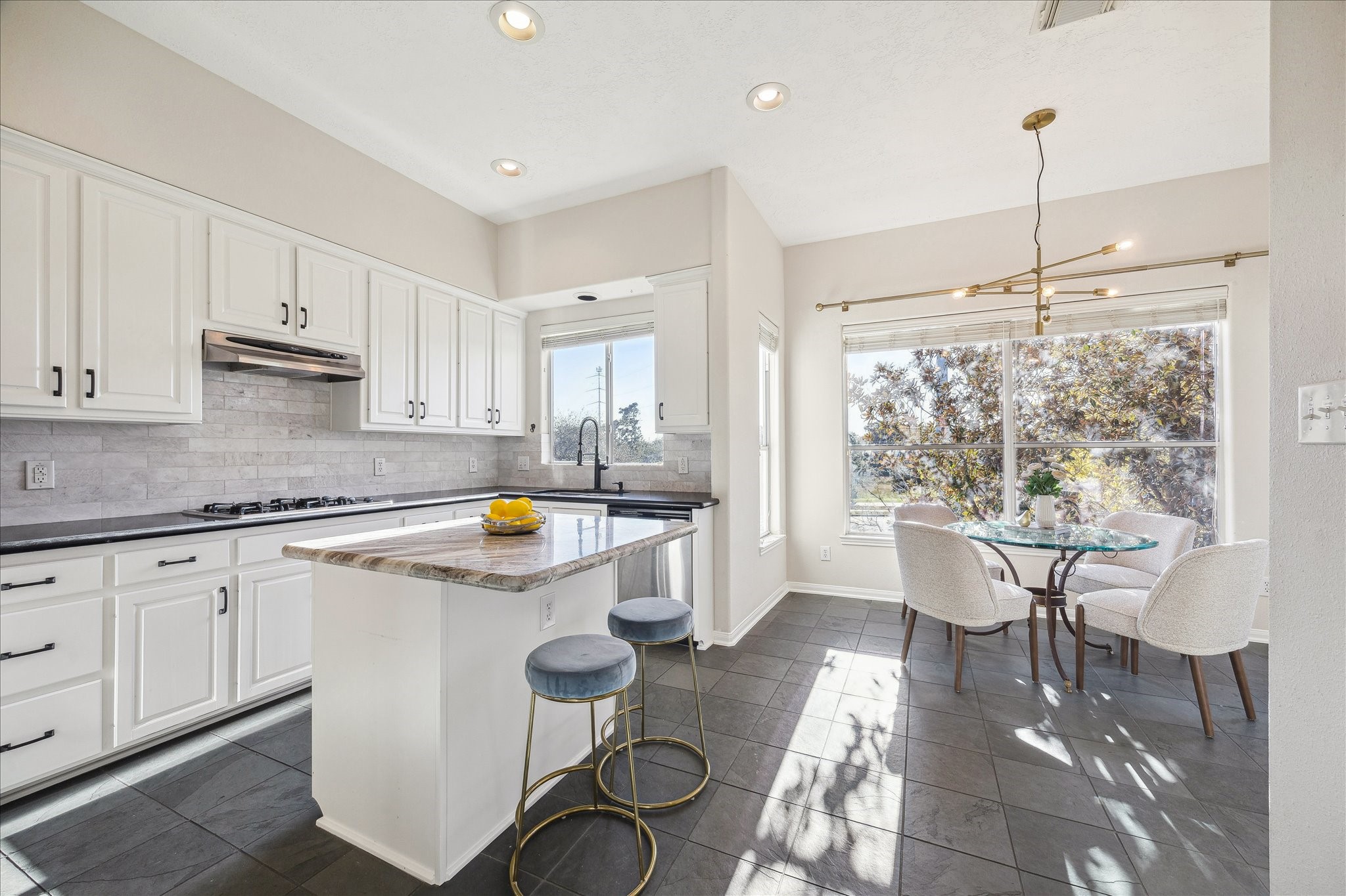 1839 Stacy Crest Houston, TX 77008 - Photo 8 of 39 a kitchen with a table chairs stove and cabinets