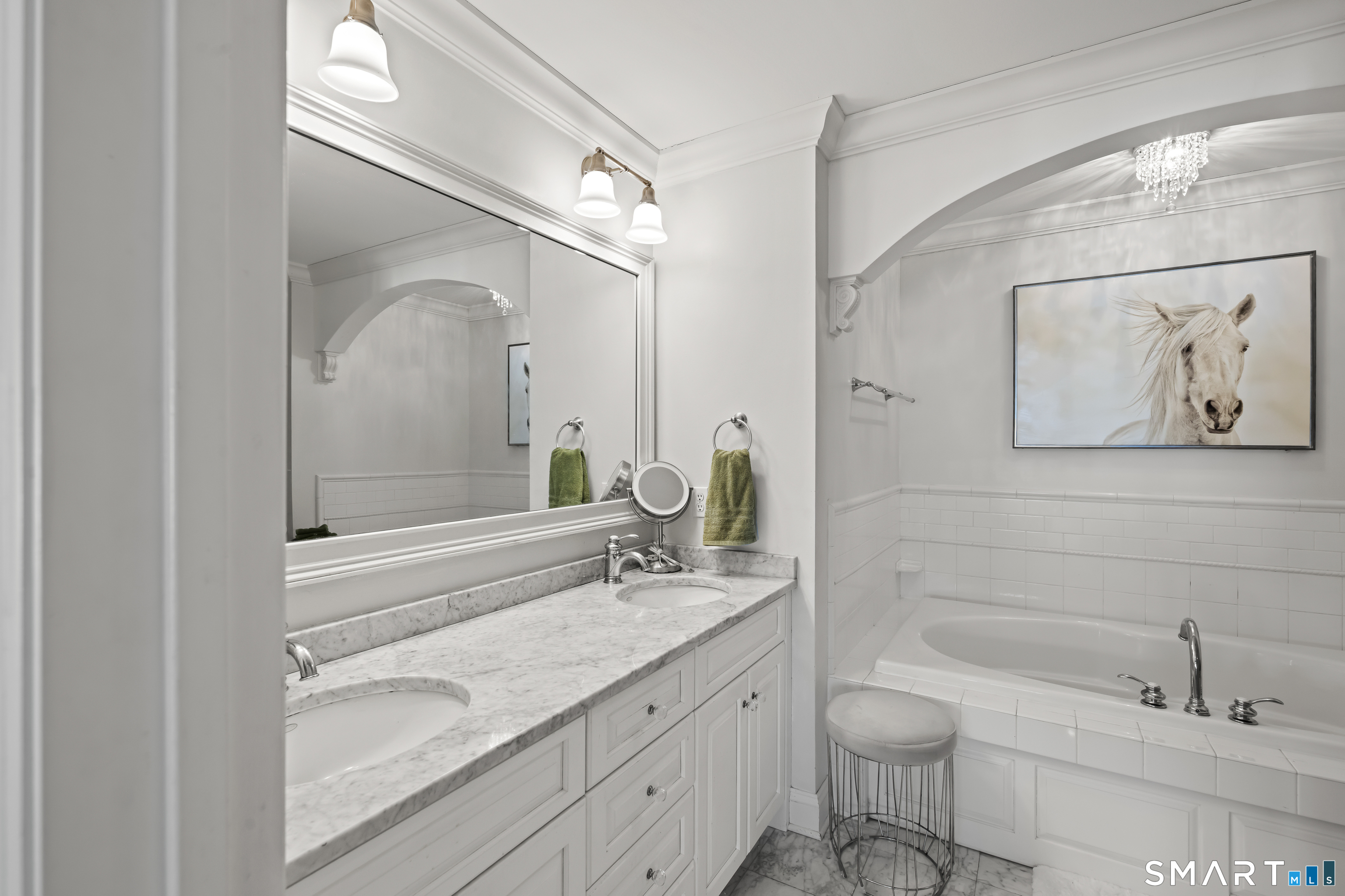 71 Aberdeen Way, Unit 71 Fairfield, CT 06890 - Photo 22 of 37 a bathroom with a granite countertop sink a toilet a and mirror