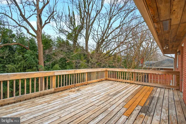a view of a house with large trees