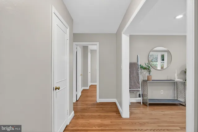 a view of a room with wooden floor and staircase