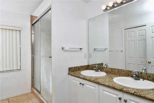 a bedroom with a bed and curtain