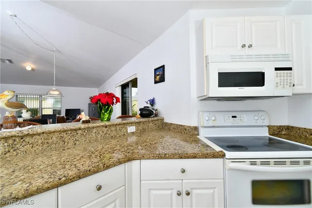 a living room with furniture and a garden