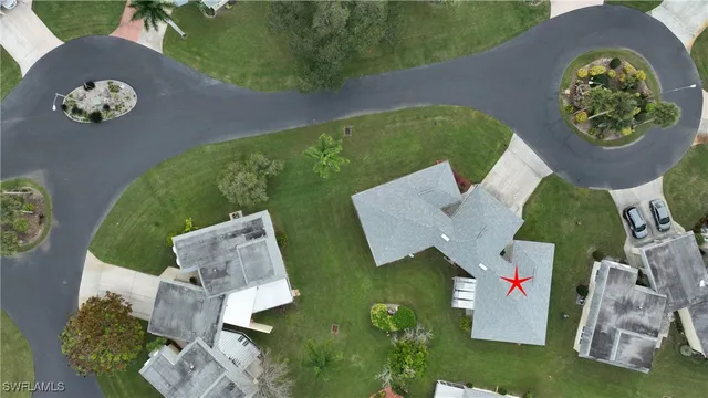 an aerial view of a house with garden space and patio