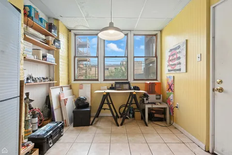 a view of a dining room with furniture window and outside view