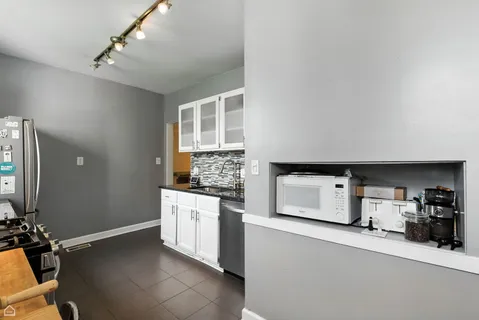 a kitchen with a stove and a sink
