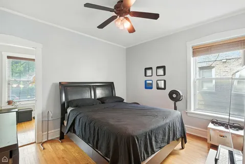 a bathroom with a toilet a sink and a mirror