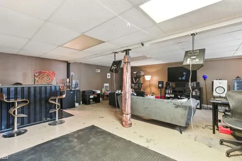 a view of a livingroom with furniture and a window