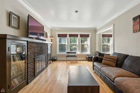 a living room with furniture fireplace and flat screen tv