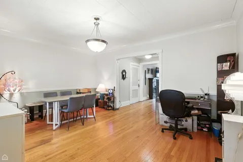 a view of a workspace with furniture and a workspace