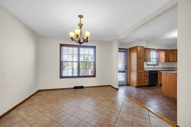 a view of a kitchen with furniture and a window