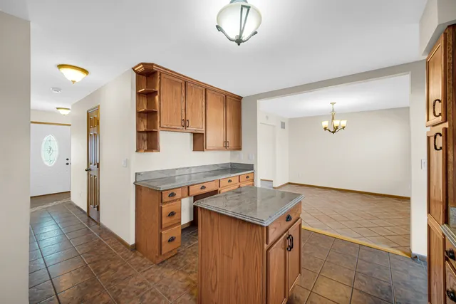 a kitchen that has a cabinets and a stove