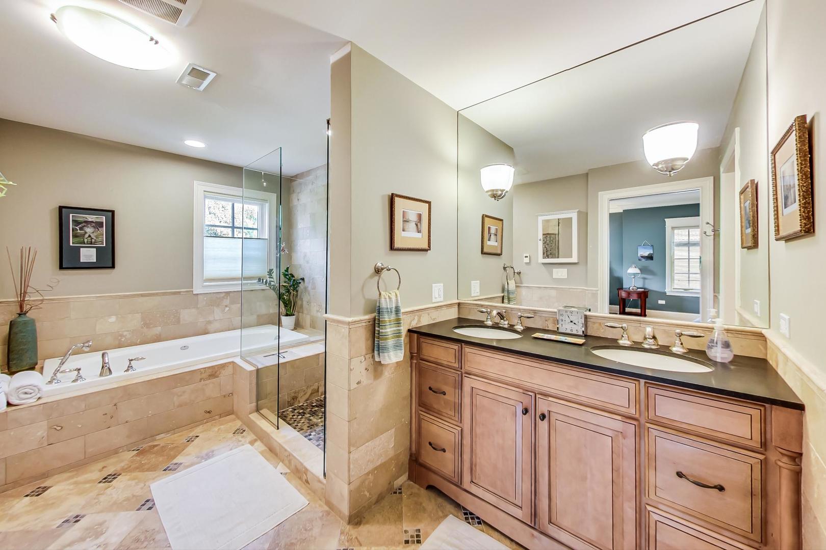 335 Ridge Road Kenilworth, IL 60043 - Photo 11 of 26 a spacious bathroom with a tub sink and mirror