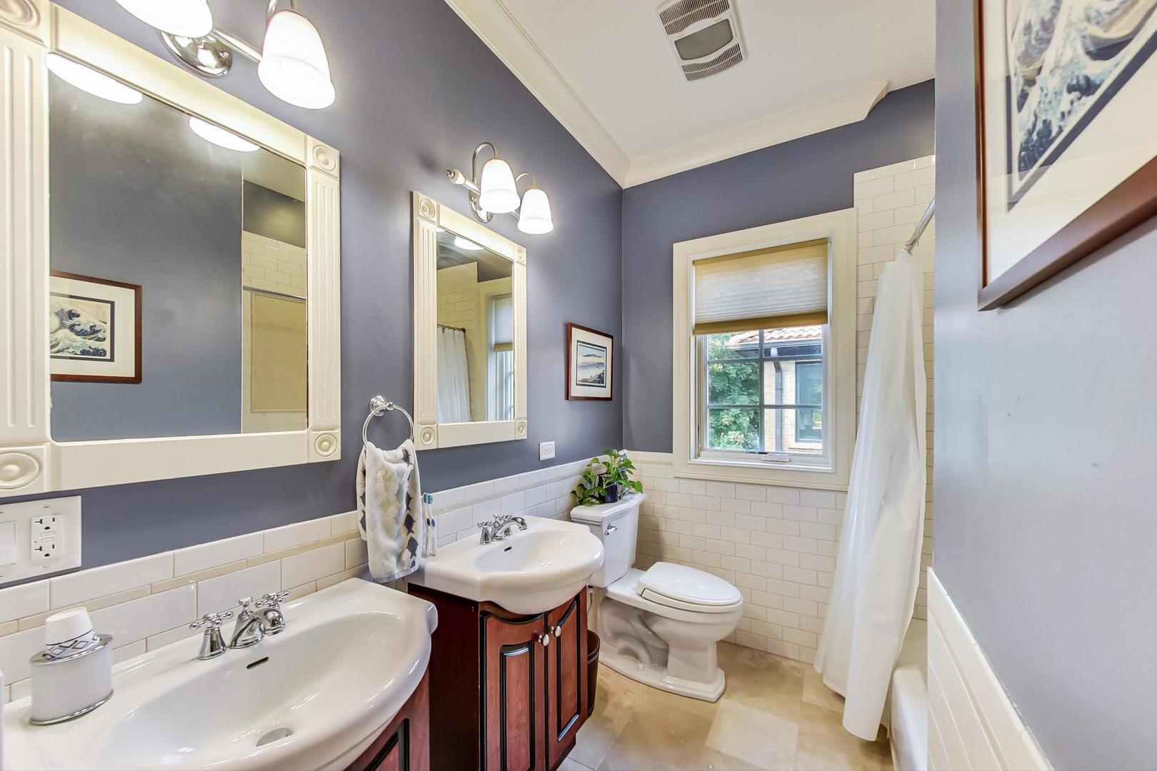 335 Ridge Road Kenilworth, IL 60043 - Photo 15 of 26 a bathroom with a granite countertop sink toilet and a mirror