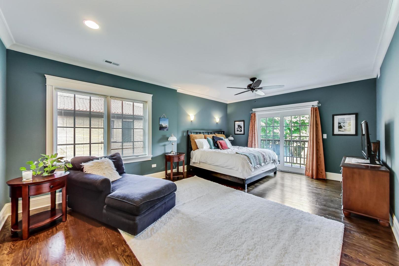 335 Ridge Road Kenilworth, IL 60043 - Photo 10 of 26 a spacious bedroom with a bed and wooden floor