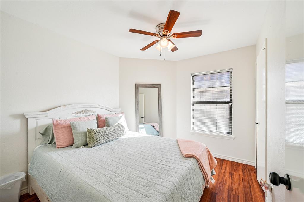 4522 Ebb Tide Drive Rowlett, TX 75088 - Photo 16 of 26 a bedroom with a large bed and a window