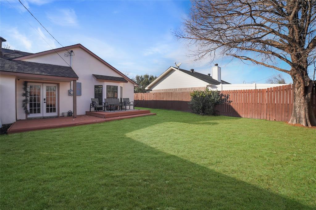 4522 Ebb Tide Drive Rowlett, TX 75088 - Photo 21 of 26 a front view of a house with garden