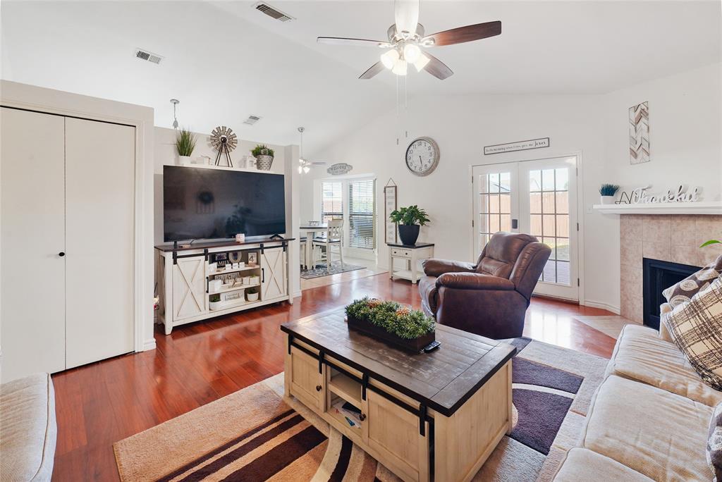 4522 Ebb Tide Drive Rowlett, TX 75088 - Photo 4 of 26 a living room with furniture a flat screen tv and a window