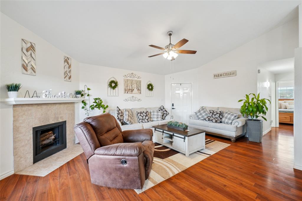 4522 Ebb Tide Drive Rowlett, TX 75088 - Photo 6 of 26 a living room with furniture and a fireplace