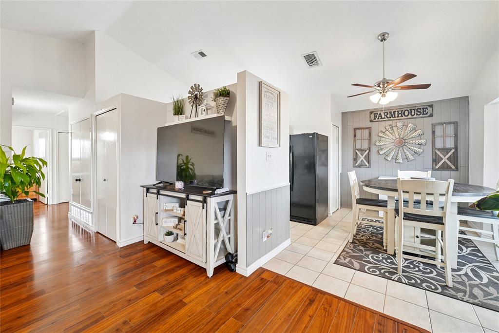 4522 Ebb Tide Drive Rowlett, TX 75088 - Photo 7 of 26 a living room with stainless steel appliances kitchen island granite countertop furniture and a wooden floor