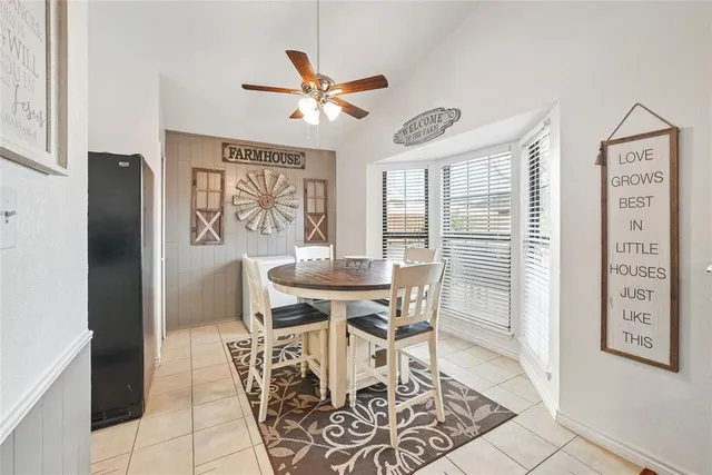 a view of a dining room with furniture and window