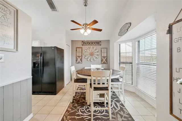 a dining room with furniture and window