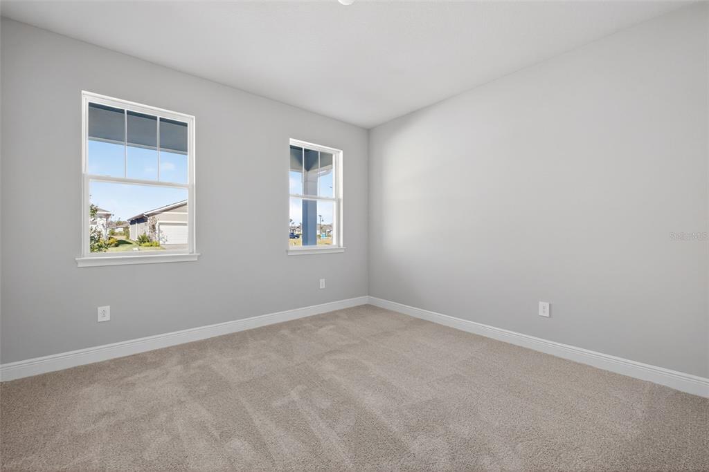 12349 49th Street East Parrish, FL 34219 - Photo 18 of 38 an empty room with windows