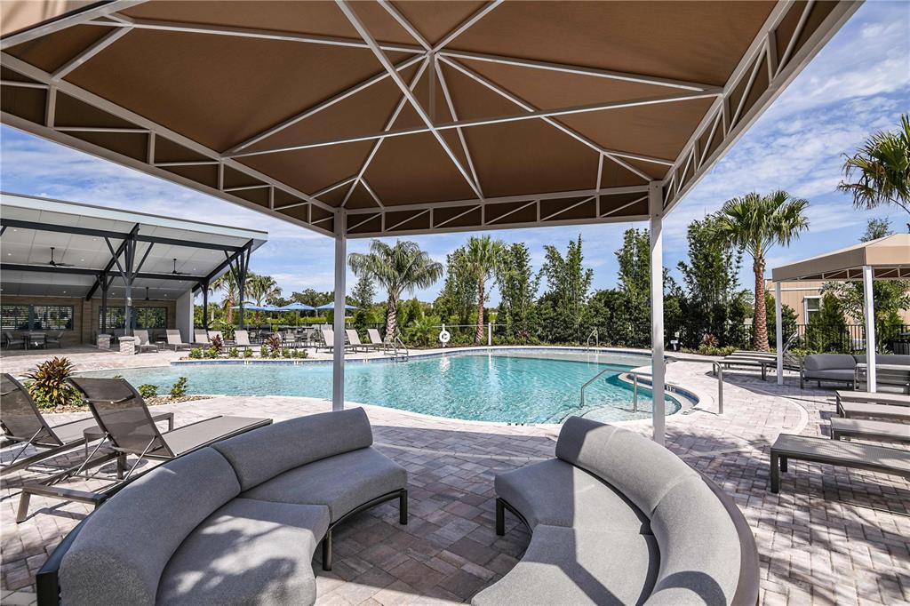 12349 49th Street East Parrish, FL 34219 - Photo 34 of 38 a outdoor living space with patio furniture and a patio