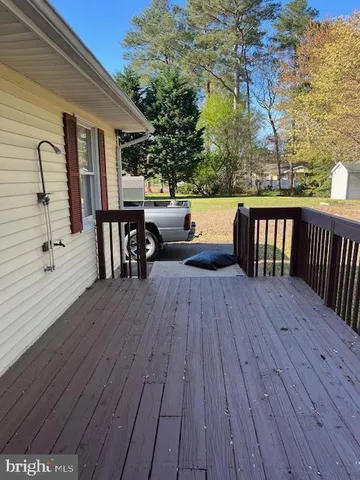 swimming pool view with a seating space