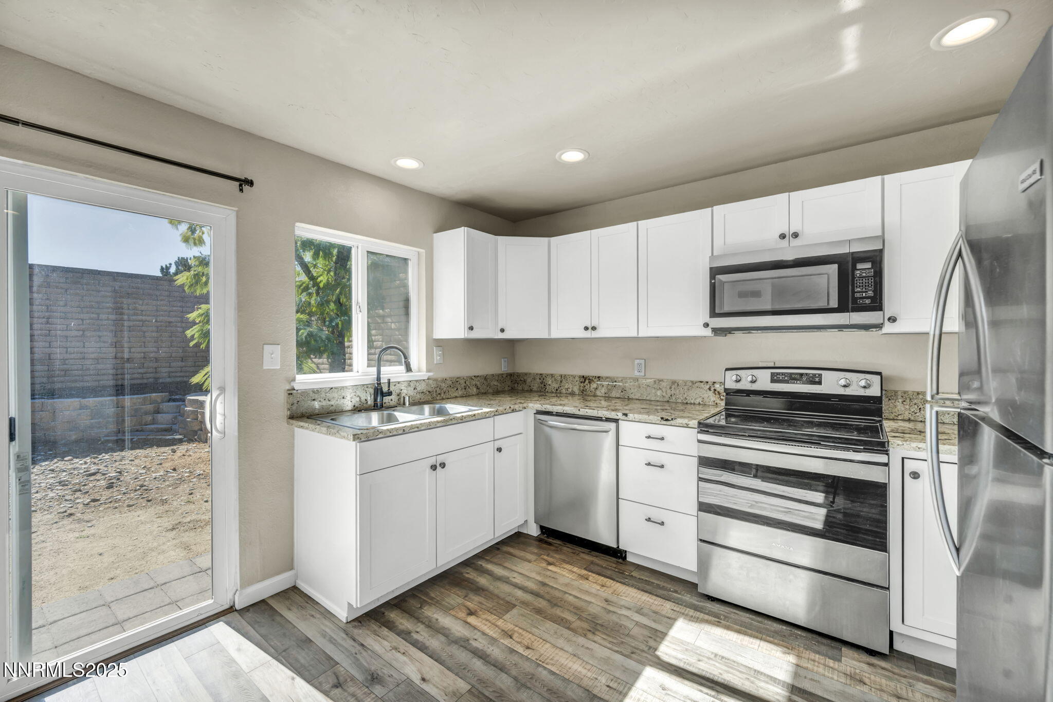 11 Castle Way Carson City, NV 89706 - Photo 12 of 34 a kitchen with stainless steel appliances granite countertop a stove and a sink
