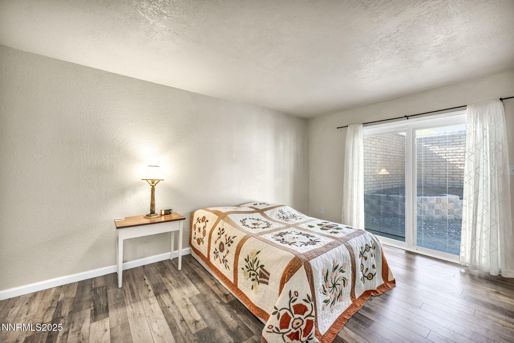 11 Castle Way Carson City, NV 89706 - Photo 18 of 34 a bedroom with a bed and a lamp