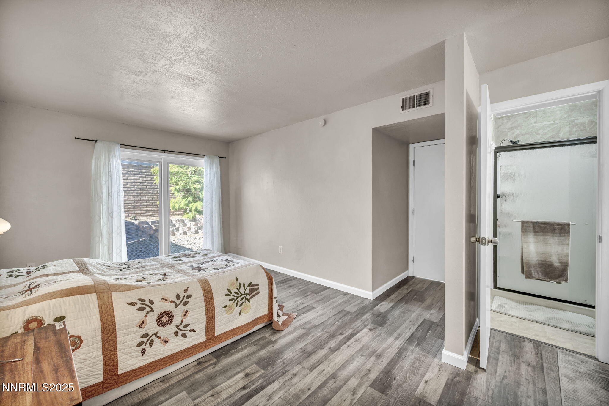 11 Castle Way Carson City, NV 89706 - Photo 19 of 34 a bedroom with a bed next to a window