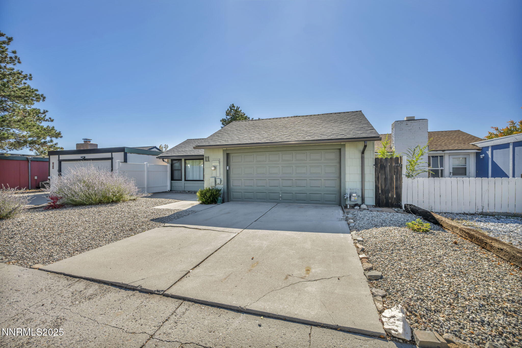 11 Castle Way Carson City, NV 89706 - Photo 2 of 34 a front view of a house with a yard and garage