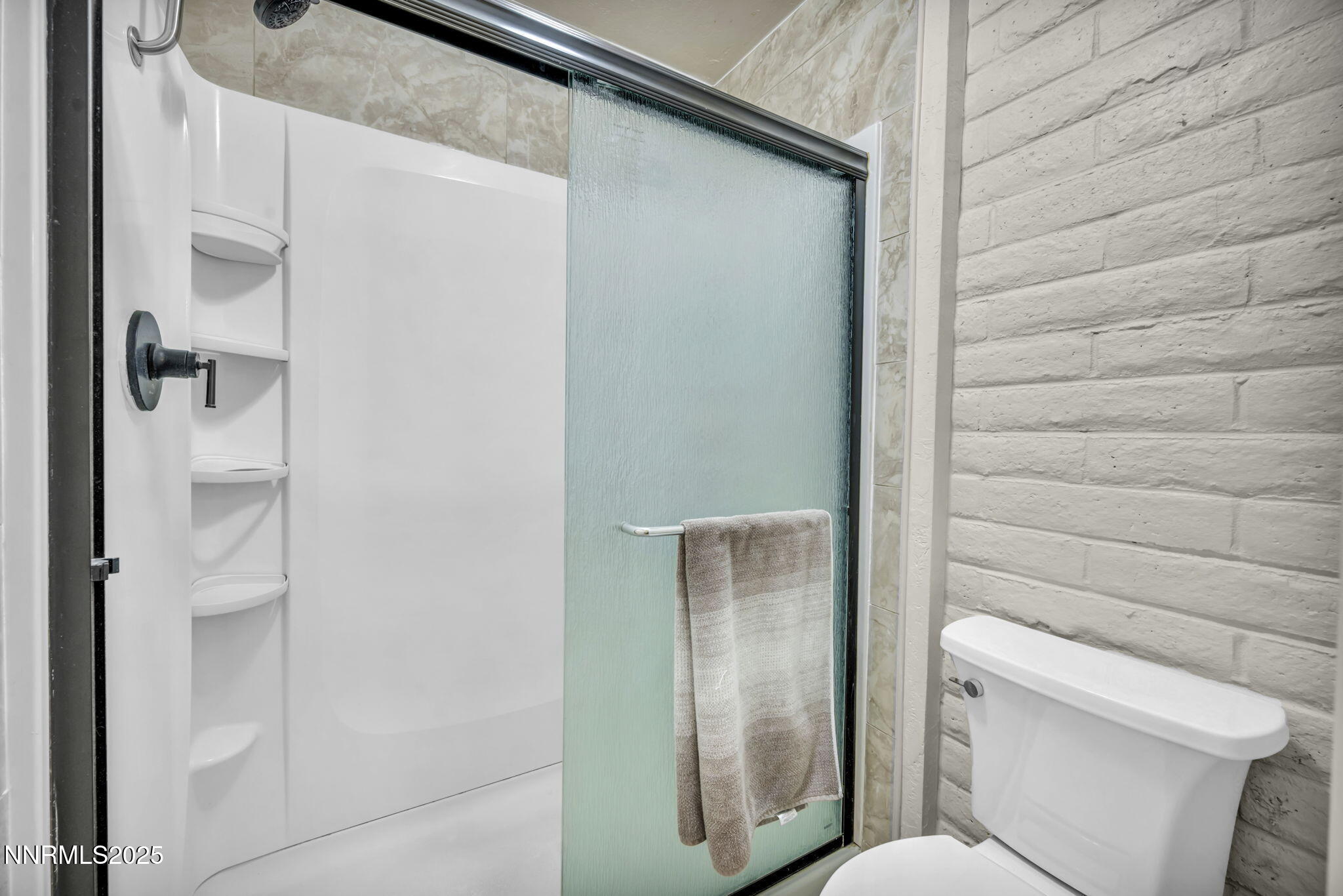 11 Castle Way Carson City, NV 89706 - Photo 21 of 34 a bathroom with a toilet and shower