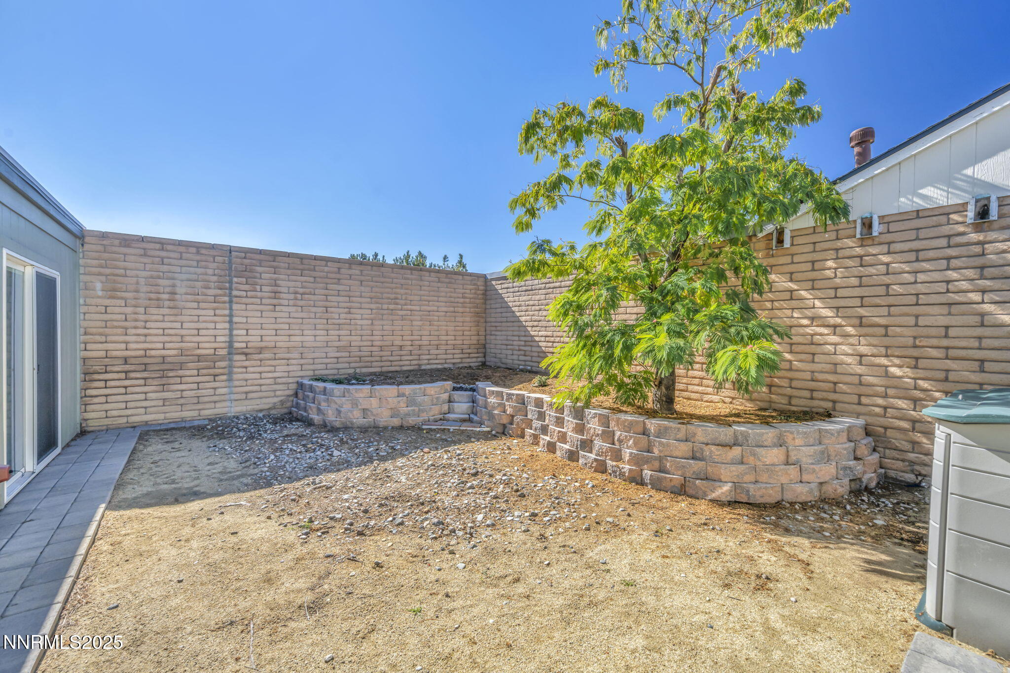 11 Castle Way Carson City, NV 89706 - Photo 29 of 34 a view of backyard with plants and wooden fence